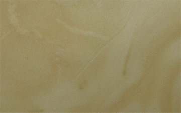 Regular bone raw amber with uniform warm ivory opacity and subtle internal wisps